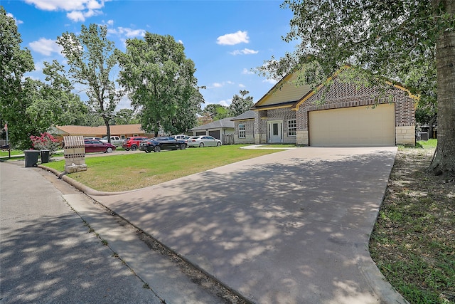 view of front of property with a garage and a front yard