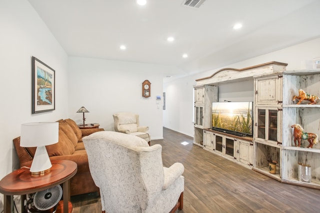 living room with dark hardwood / wood-style flooring