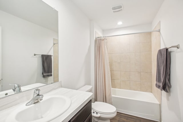 full bathroom featuring vanity, toilet, shower / bath combo with shower curtain, and hardwood / wood-style flooring