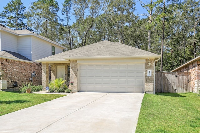 view of front facade with a front yard and a garage