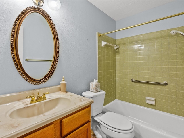 full bathroom with tiled shower / bath combo, toilet, and vanity