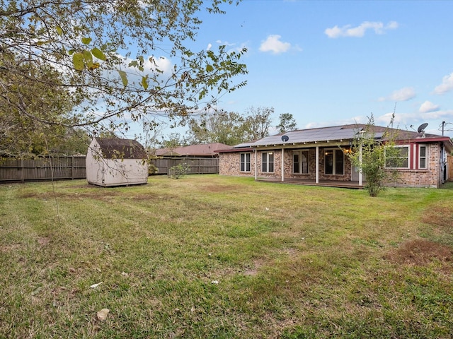 view of yard with a storage unit