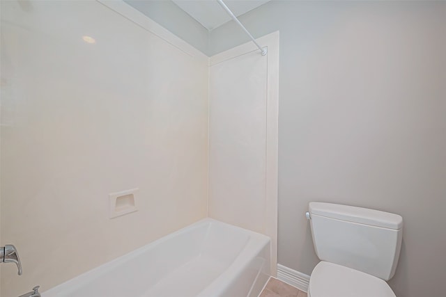 bathroom featuring tile patterned floors, shower / bathtub combination, and toilet