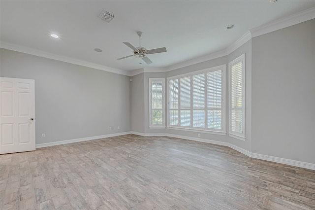 spare room with ceiling fan, crown molding, and light hardwood / wood-style flooring