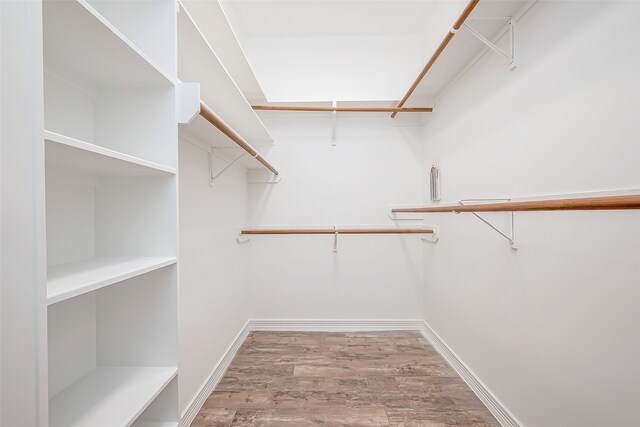 walk in closet featuring light hardwood / wood-style flooring