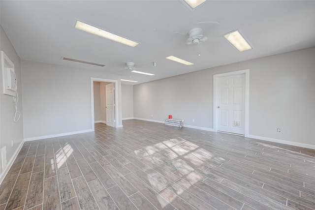 unfurnished room featuring ceiling fan and light wood-type flooring