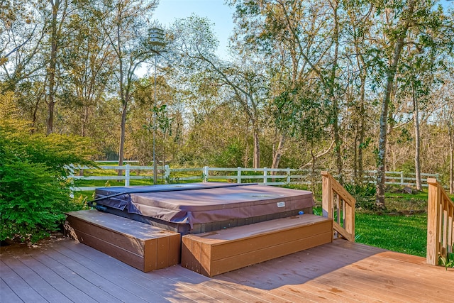 wooden deck featuring a covered hot tub