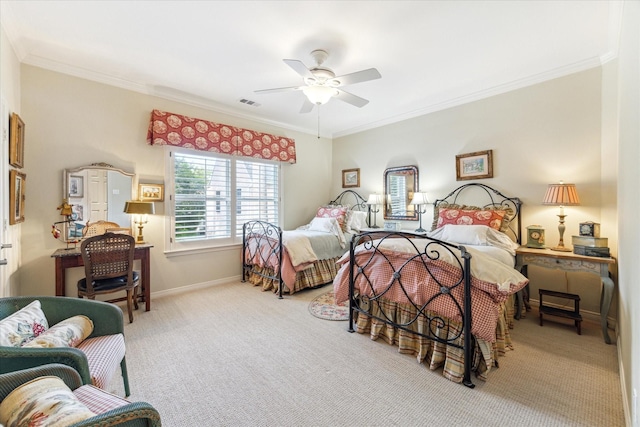 carpeted bedroom with ornamental molding, a ceiling fan, visible vents, and baseboards