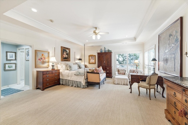 bedroom with recessed lighting, light colored carpet, a ceiling fan, a raised ceiling, and crown molding