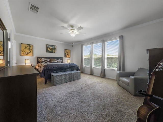 bedroom with ceiling fan, crown molding, and carpet flooring