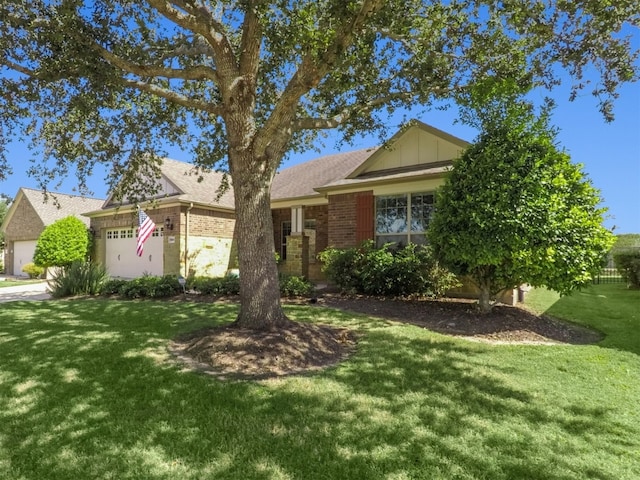 single story home with a garage and a front lawn