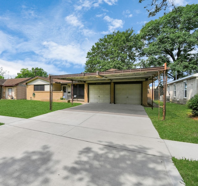 single story home with a garage and a front lawn