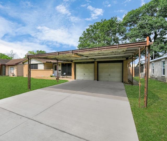 ranch-style home featuring a carport, a garage, and a front yard