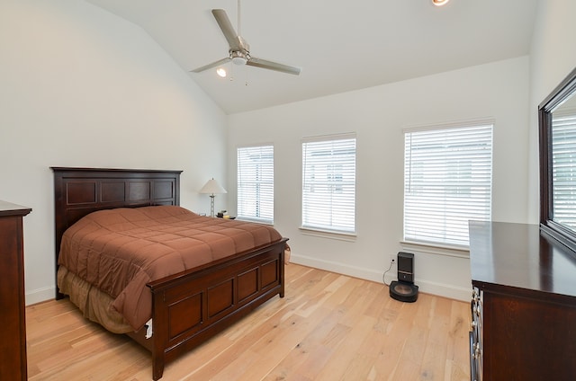 bedroom with lofted ceiling, light hardwood / wood-style floors, and ceiling fan