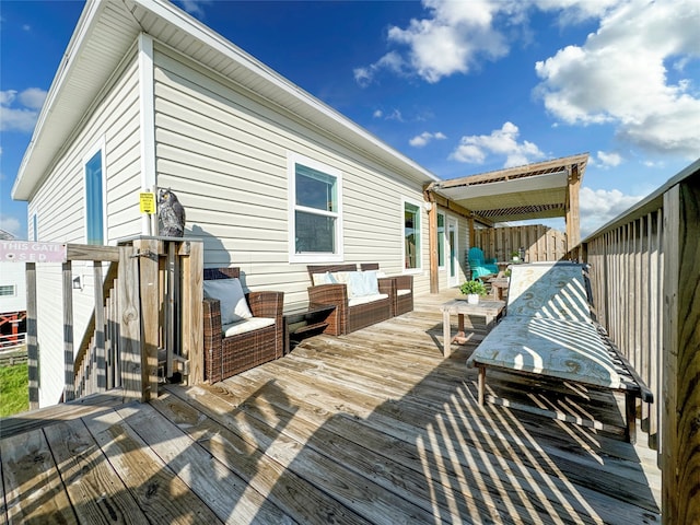 wooden terrace featuring an outdoor hangout area