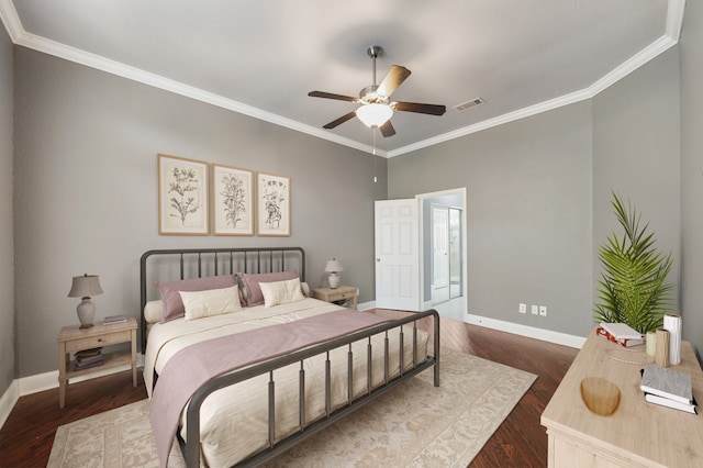 bedroom featuring ornamental molding, dark hardwood / wood-style floors, and ceiling fan