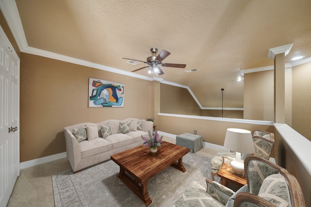 living room featuring ceiling fan, a textured ceiling, crown molding, and vaulted ceiling