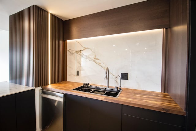2929 Buffalo Speedway Unit A204, Houston, TX 77098 - kitchen with wooden counters, a sink, stainless steel dishwasher, and modern cabinets