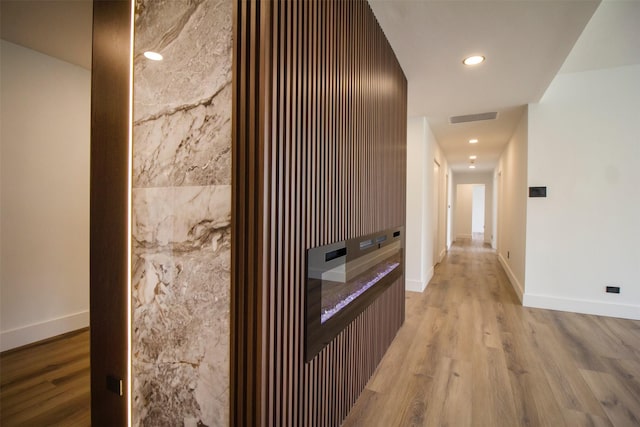 2929 Buffalo Speedway Unit A204, Houston, TX 77098 - corridor with light wood-style flooring, recessed lighting, and baseboards