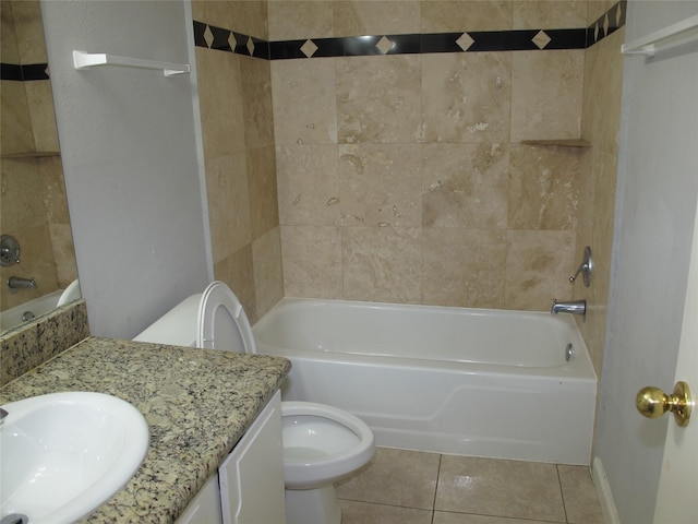 full bathroom featuring tiled shower / bath combo, tile patterned flooring, vanity, and toilet