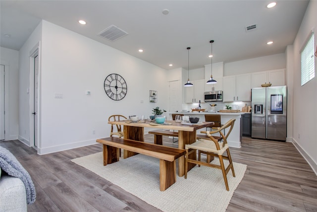 dining room featuring light wood-type flooring