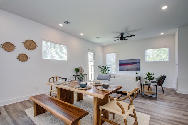 dining space featuring light hardwood / wood-style floors and ceiling fan