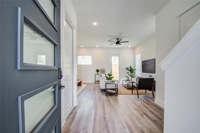 foyer featuring ceiling fan and light hardwood / wood-style flooring