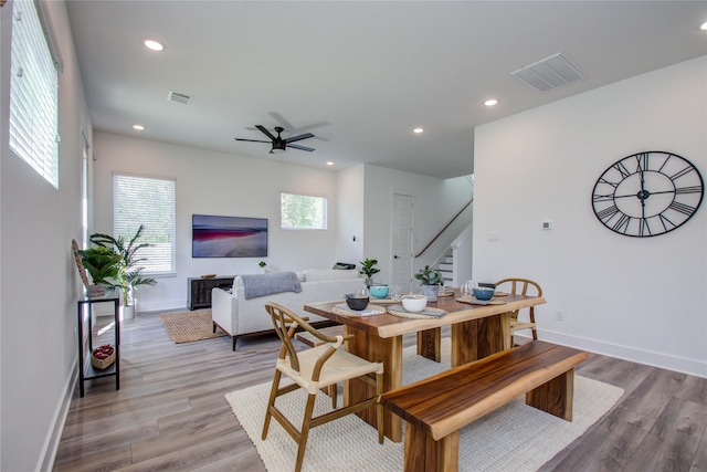 dining area featuring light hardwood / wood-style floors and ceiling fan