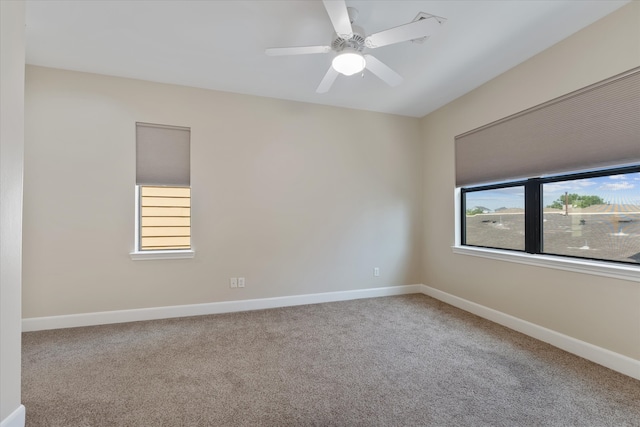 empty room with carpet floors and ceiling fan