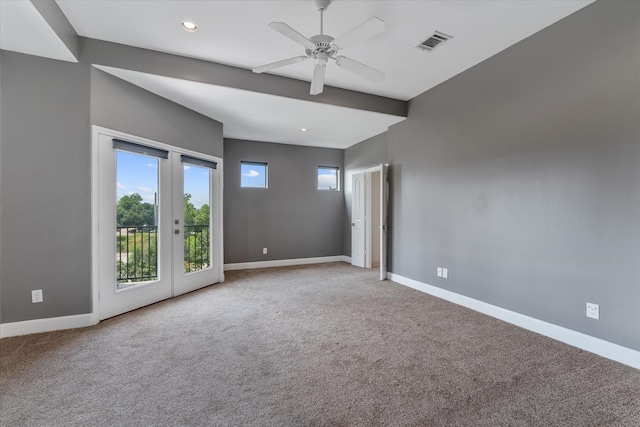 carpeted empty room with ceiling fan and french doors