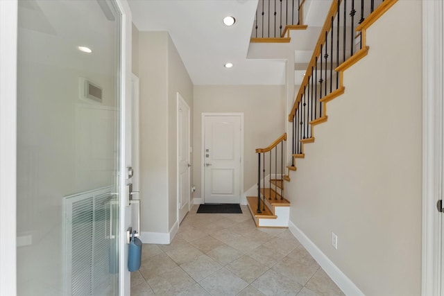 entrance foyer featuring light tile patterned floors