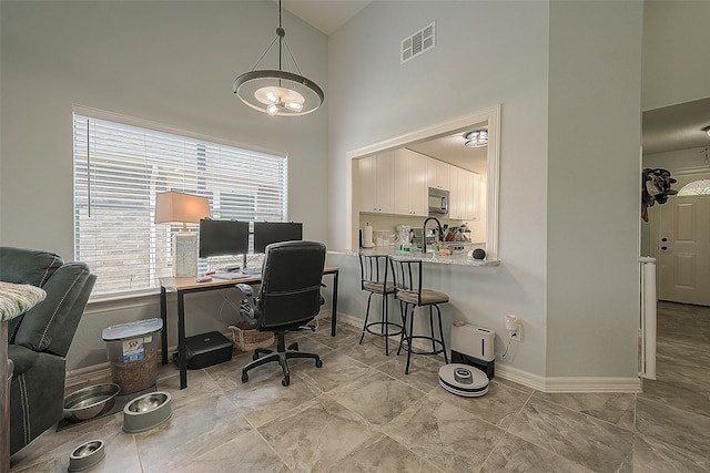 home office with high vaulted ceiling