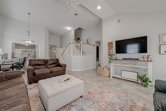 living room featuring high vaulted ceiling and ceiling fan