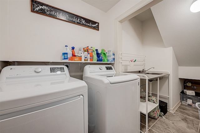 clothes washing area featuring washing machine and clothes dryer