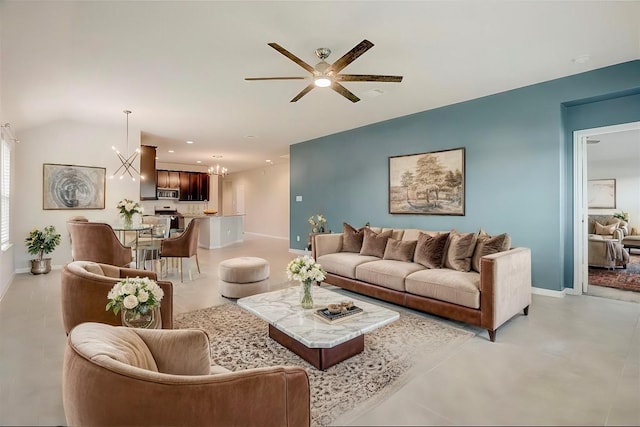 living room featuring ceiling fan with notable chandelier