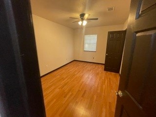 empty room featuring light hardwood / wood-style floors and ceiling fan