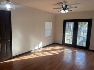 spare room featuring ceiling fan, french doors, and light hardwood / wood-style flooring