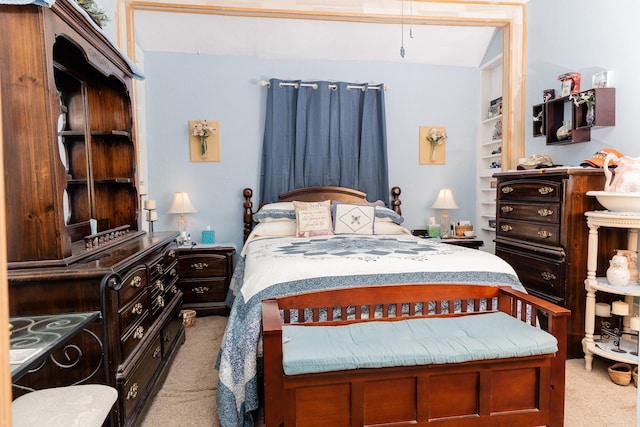 bedroom featuring light colored carpet