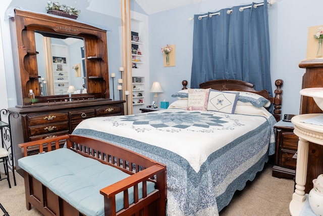 bedroom featuring light carpet