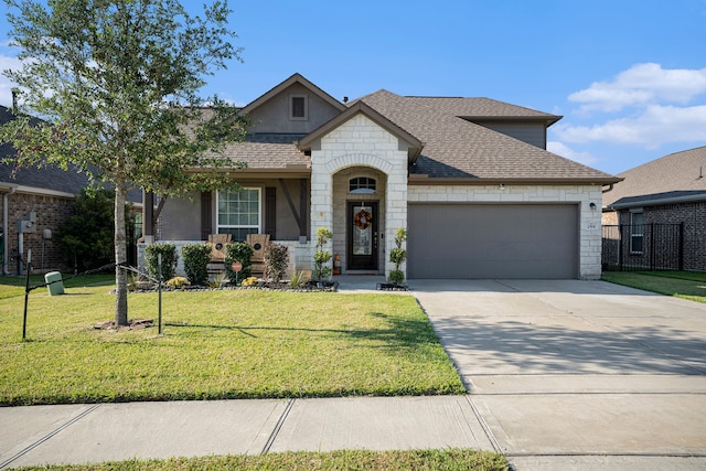 view of front of house featuring a front yard and a garage