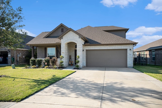 view of front of house with a garage and a front lawn