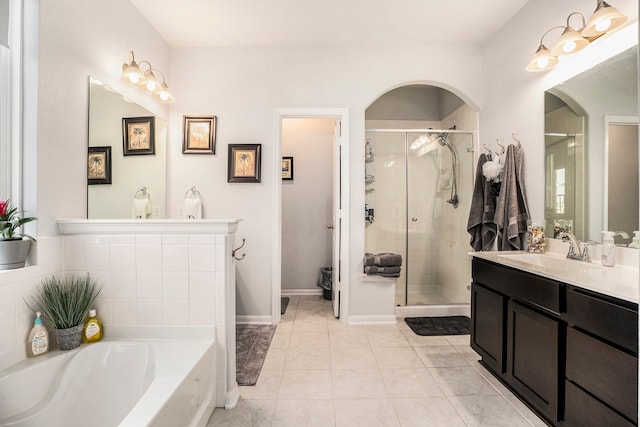 bathroom with vanity, tile patterned floors, and separate shower and tub