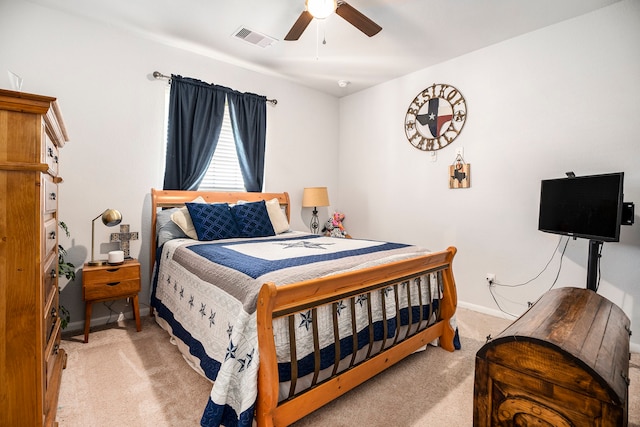 bedroom featuring ceiling fan and light carpet