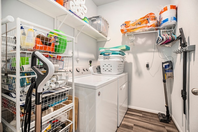 clothes washing area featuring dark hardwood / wood-style flooring and independent washer and dryer