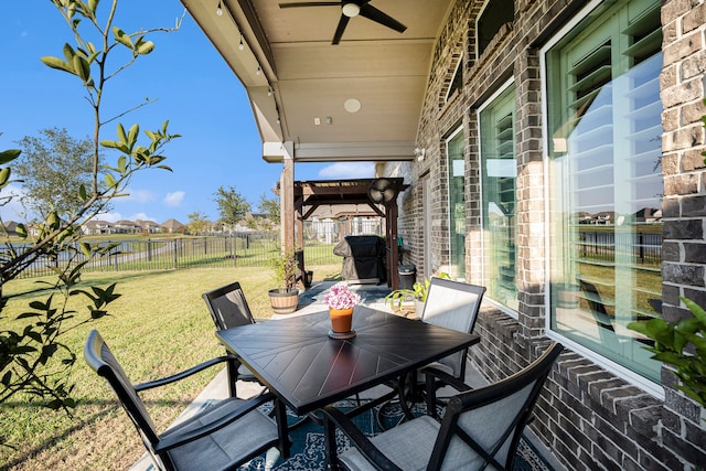 view of patio featuring ceiling fan