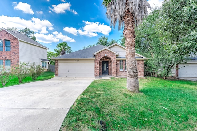 view of front of property featuring a front lawn and a garage