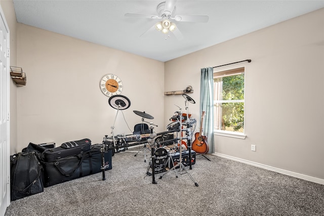 workout area with carpet and ceiling fan