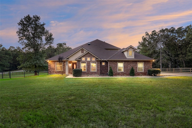 craftsman-style home featuring a yard