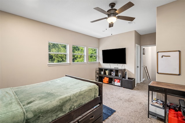 carpeted bedroom featuring ceiling fan