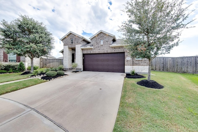 view of front of house featuring a garage and a front lawn